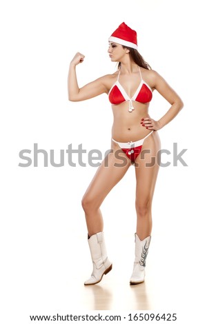 sexy girl in santa bikini showing biceps