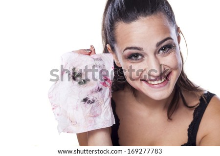nice beautiful girl shows wet wipes by which removes her makeup