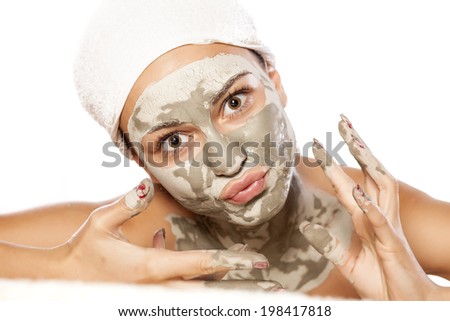 funny young girl with a mask on her face