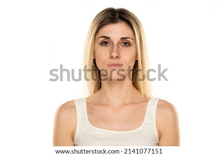 Similar – Image, Stock Photo Serious female with makeup and freckles on nose gently and looking at camera