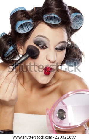 crazy woman with curlers and bad makeup applied blush