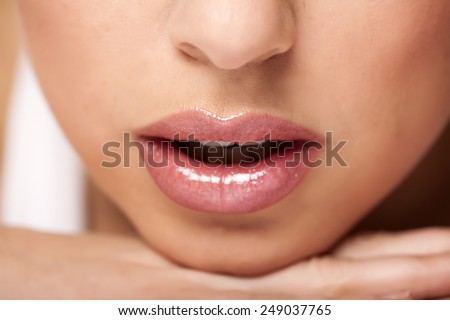 beautiful woman lips with lip gloss