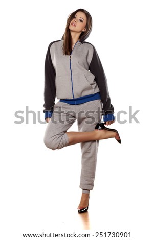 front view of young woman in track suits and high heels