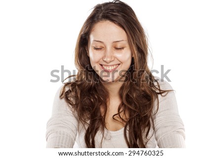smiling young woman without makeup on a white background