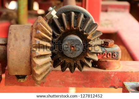 Close up on the old bevel gears on agriculture machine