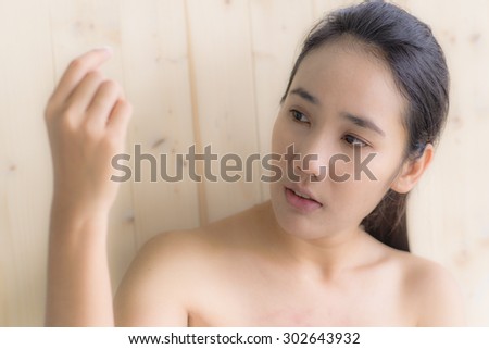 Woman see her hand while take a bath portrait