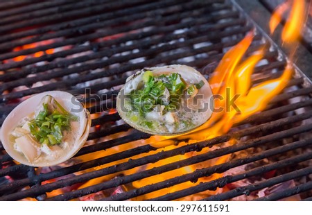 Grilling sea food on the flaming grill Summer barbecue concept seafood.