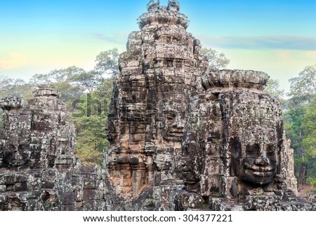 stone faces sculpture Bayon Temple Angkor Thom, Cambodia. Ancient Khmer architecture.