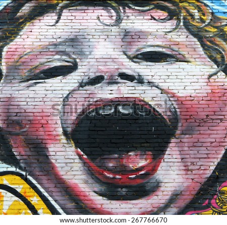 MOSCOW, RUSSIA - MAR 19, 2015: Crying baby - part of large-scale legal graffiti by Dutch painter Kwasten met de Gasten on the wall of a multistory building