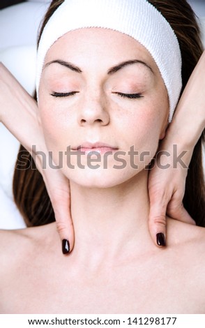 woman in a beauty clinic by becoming a massage