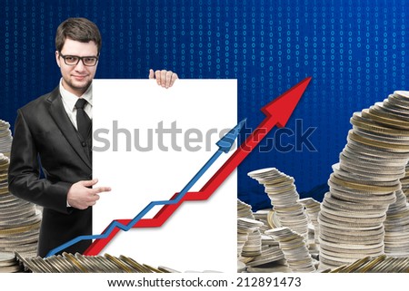 business and money concept - young businessman with money growth  showing graph,Concept of business and money growth, on blue coding background