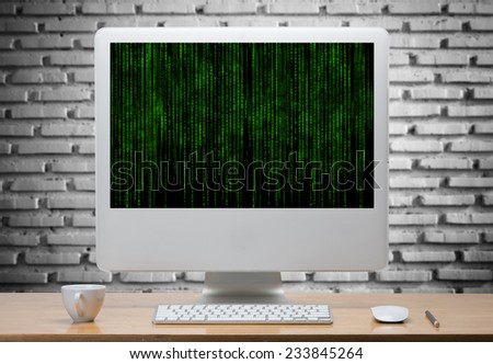 Computer and wireless keyboard,mouse on wooden table with matrix code in screen.clipping path