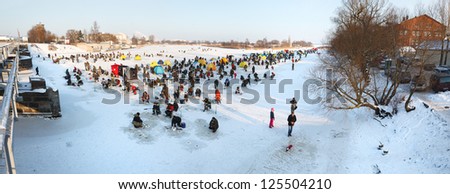 Liepaja, Latvia - JANUARY 20: People ice fishing event on frozen river, 2013 in Liepaja, Latvia