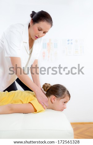 Chiropractor adjusting a patient\'s neck