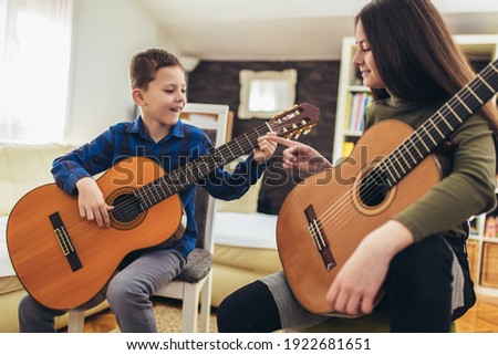 Similar – Image, Stock Photo Child playing guitar