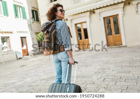 Similar – Image, Stock Photo Tourists with suitcases and masks on the platform next to the train