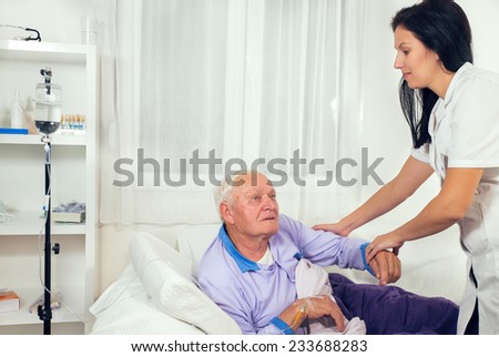 Nurse helps the patient to gets out of bed