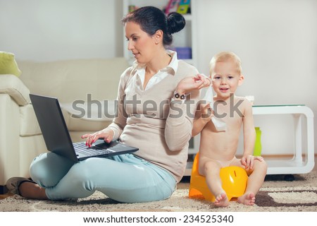 Working mother working at home and not watching his child to the potty