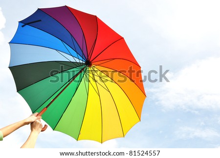Rainbow umbrella in the hands