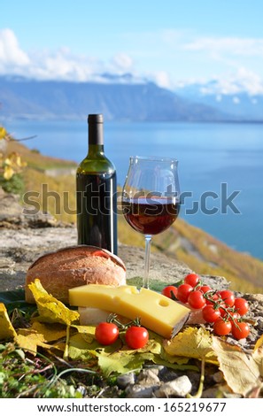 Red wine, cheese, bread and cherry tomatoes. Lavaux, Switzerland