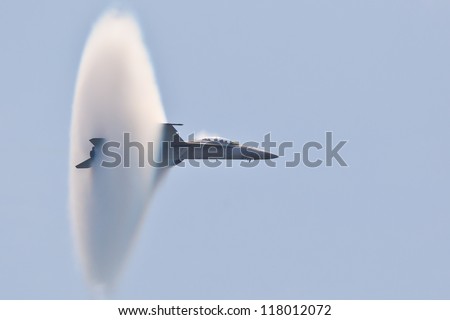 OCEAN CITY - JUNE 14:F-18 Super Hornet travels subsonic speed with visible Vapor Cone on June 14, 2012 in Ocean City, Maryland. Vapor Cone is also called Sonic Boom and is a very rare observed