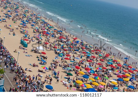 OCEAN CITY - JULY 9:Ocean City Maryland beach full of people on July 9, 2012 Ocean City MD is one of the most popular beach resorts on the East Coast and considered one of the cleanest in the country