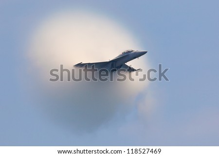OCEAN CITY - JUNE 14:F-18 Super Hornet travels subsonic speed with visible Vapor Cone on June 14, 2012 in Ocean City, Maryland. Vapor Cone is also called Sonic Boom and is a very rare observed