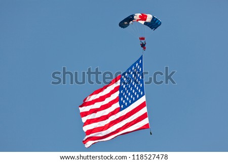 WASHINGTON DC - MAY 8:A skydiver Paul McCowan with US flag parachuting at the Joint Services Open House airshow on May 8,2012.It is the second largest known flyable American flag in existence