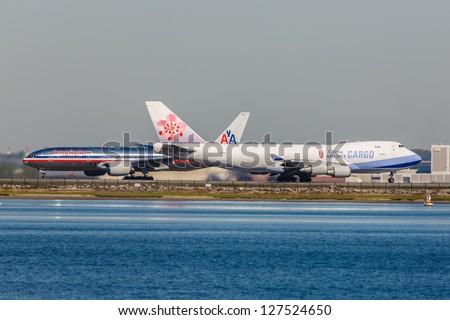 NEW YORK - DECEMBER 6: Boeing 747 China Airlines and Boeing 767 American Airlines on JFK Airport in New York USA on December 6, 2012. JFK is New York\'s main international airport opened in 1948