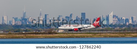 NEW YORK - DECEMBER 9: Airbus A320 Virgin lining up on JFK Airport in New York on December 9, 2012. JFK Is rated 4th biggest American Airport, Call sign used by Virgin America is Redwood