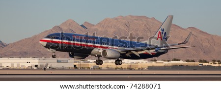 LAS VEGAS - NOVEMBER 14: Boeing 737 American Airline lands on McCarran airport in Las Vegas, USA on November 14, 2010. American Airlines is one of the biggest and oldest major American airlines