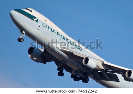 NEW YORK - FEBRUARY 1: Boeing 747 of Cathey Pacific climbs after take off from JFK airport in New York, USA on February 1, 2011. Cathey founded on 24 September 1946 Is flag carrier airline of Honk Kong