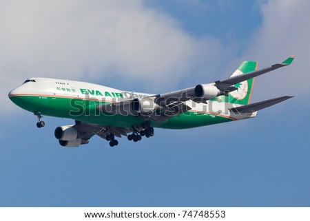 NEW YORK - MARCH 10: Boeing 747 EVA Cargo approaches JFK Airport in New York, USA on March 10, 2011. 747 most popular cargo plane used by commercial airlines Her nickname: Queen of the sky