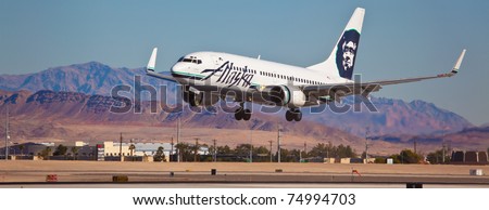LAS VEGAS - NOVEMBER 12: Boeing 737 Alaska Airline touches down in McCarran in Las Vegas, USA on November 12, 2010. Alaska\'s route system spans more than 92 cities in United States Canada and Mexico