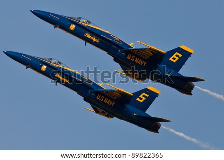 PENSACOLA, FL - NOVEMBER 11: The US Navy Blue Angels in F-18 Hornet planes perform in air show routine in Pensacola, FL on November 11, 2011. The Blue Angels are the oldest active aerobatic team in the world.