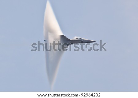 OCEAN CITY, USA - JUNE 12:F-18 Super Hornet travels subsonic speed with visible Vapor Cone on June 12, 2011 in Ocean City, MD, USA. Vapor Cone is also called Sonic Boom and is a very rare observed