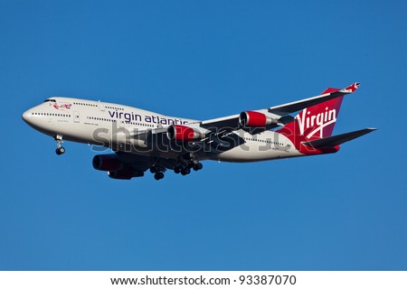 NEW YORK - JANUARY 2: Boeing 747 Virgin Atlantic approaches JFK Airport in New York on January 2, 2012 Plane is wearing new livery announced in early 2011 Boeing 747 is popularly called Jumbo Jet