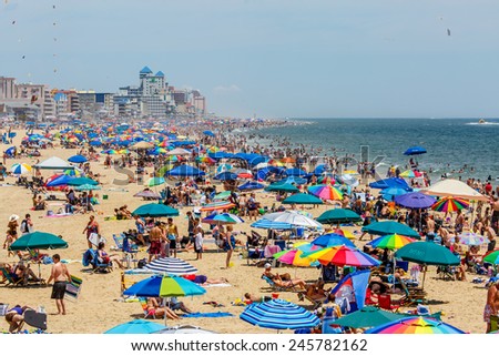OCEAN CITY - JULY 6: Crowded beach in Ocean City, MD on July 6, 2014. Ocean City, MD is a popular beach resorts on East Coast and one of the cleanest in the country.