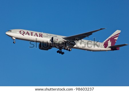NEW YORK - MARCH 5:Boeing 777 Qatar on final approach to JFK in New York, USA on March 5, 2012 Qatar Airline is rated 3rd best airlines in the world Qatar airline is flag carrier airline of Qatar
