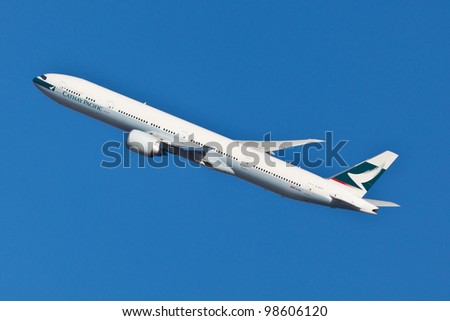 NEW YORK - MARCH 9: Boeing 777 Cathey Pacific climbs after take off from JFK airport in New York, USA on March 9, 2012 Cathey founded on September 24, 1946 is flag carrier airline of Honk Kong