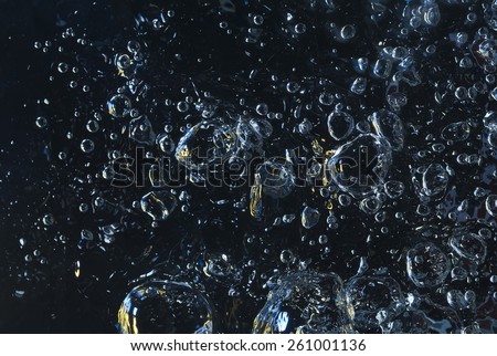 Abstract underwater with bubbles on a dark background