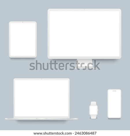 White desktop computer, laptop, smartphone, tablet and smart watch