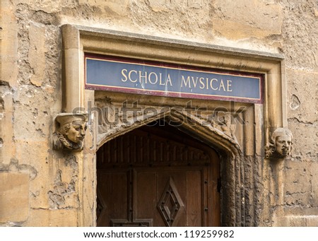Carved wooden door at entrance to School of Music at Bodeian Library University of Oxford