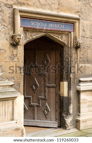 Carved wooden door at entrance to School of Music at Bodeian Library University of Oxford
