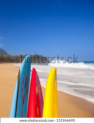 Vertical format of surf boards by stormy ocean