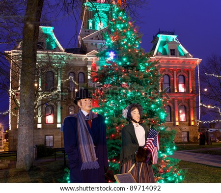 CAMBRIDGE, OHIO - NOVEMBER 24: Christmas lighting on the old Court House building in Cambridge Ohio on November 24, 2011. This annual event uses Dickens characters on the main street.