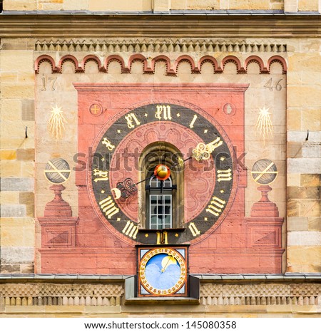 Detail of the 1746 church clock and astronomical phases of moon on medieval church of St Michael in the town square of Schwabisch Hall in Germany