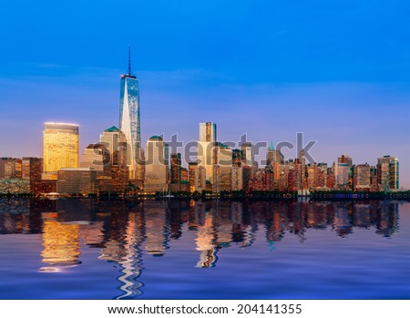 Skyline of lower Manhattan of New York City from Exchange Place at night with World Trade Center at full height of 1776 feet