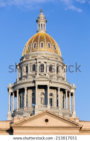 The gold leaf covered dome of the State Capitol Dome in Denver Colorado ...