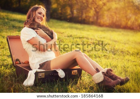 Friendship with an Easter Bunny / Vintage style photo from a beautiful young woman with her bunny